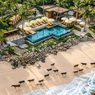 Vila NIHI Sumba dengan kolam renang dan arsitektur tradisional di tengah alam